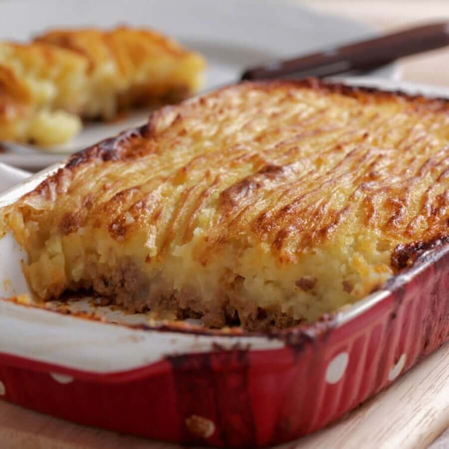 Classic cottage pie perfectly crisped in a rustic baking dish
