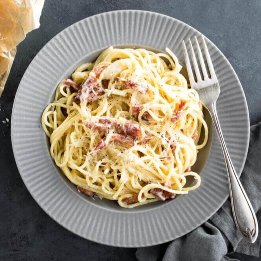 Carbonara pasta, spaghetti with pancetta, egg, hard parmesan cheese and cream sauce. A traditional Italian dish